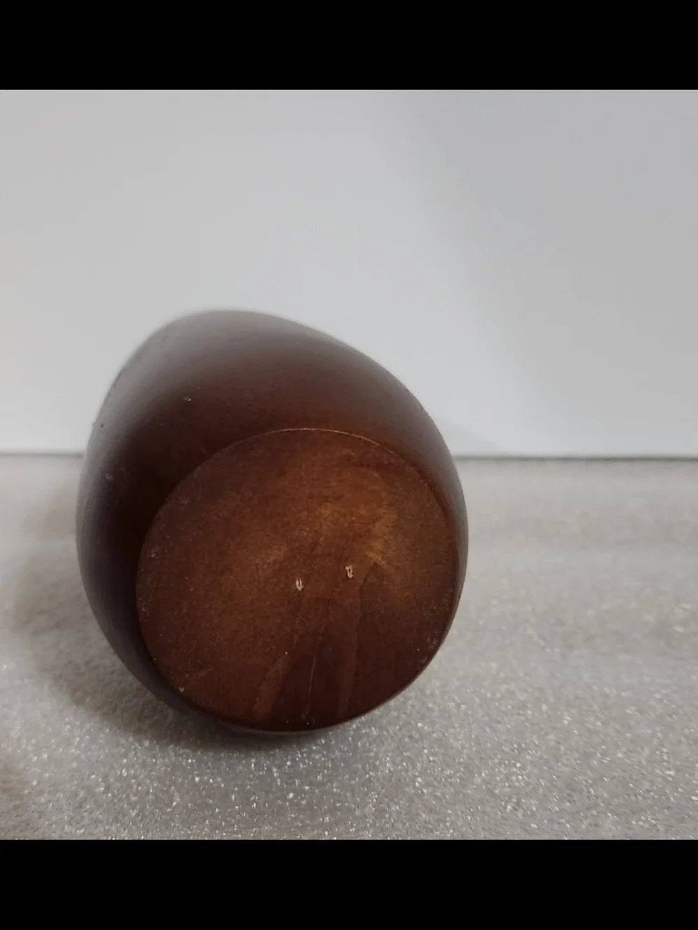 Vintage, mid-century modern style candle holder is crafted from turned wood with